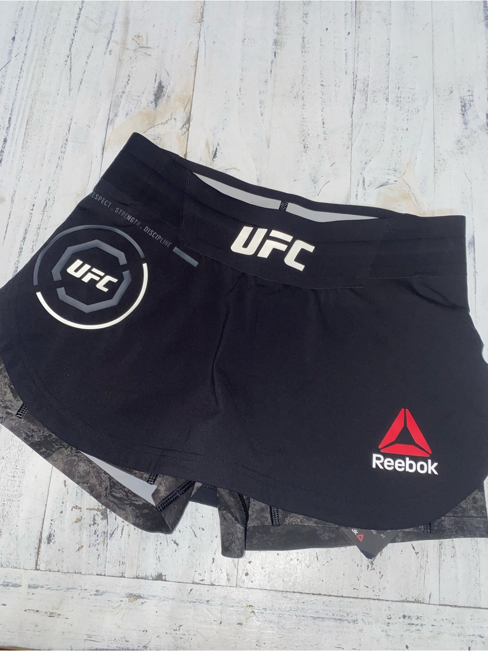 Reebok Women’s Black UFC Athletic Shorts with Red Logo